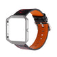 Smartwatch with orange leather strap and black/red abstract pattern, metal clasp visible