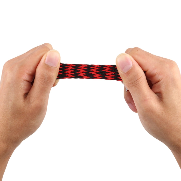 Hands adjusting a red and black braided single-loop watchband