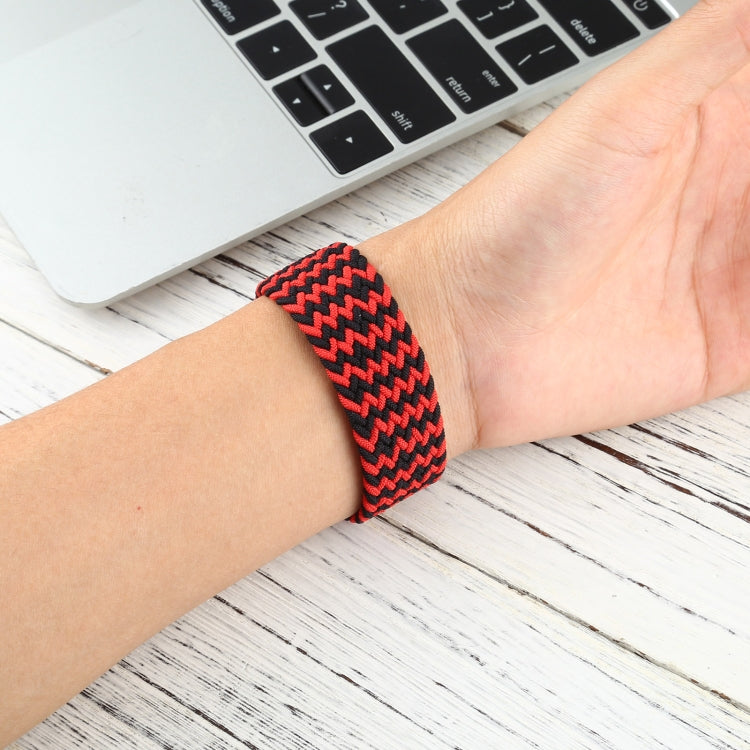 Red and black zigzag braided nylon watchband with single loop, worn on wrist