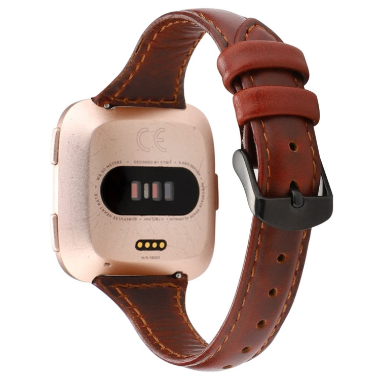 Genuine leather Fitbit Versa strap in red-brown with metal buckle and punched holes