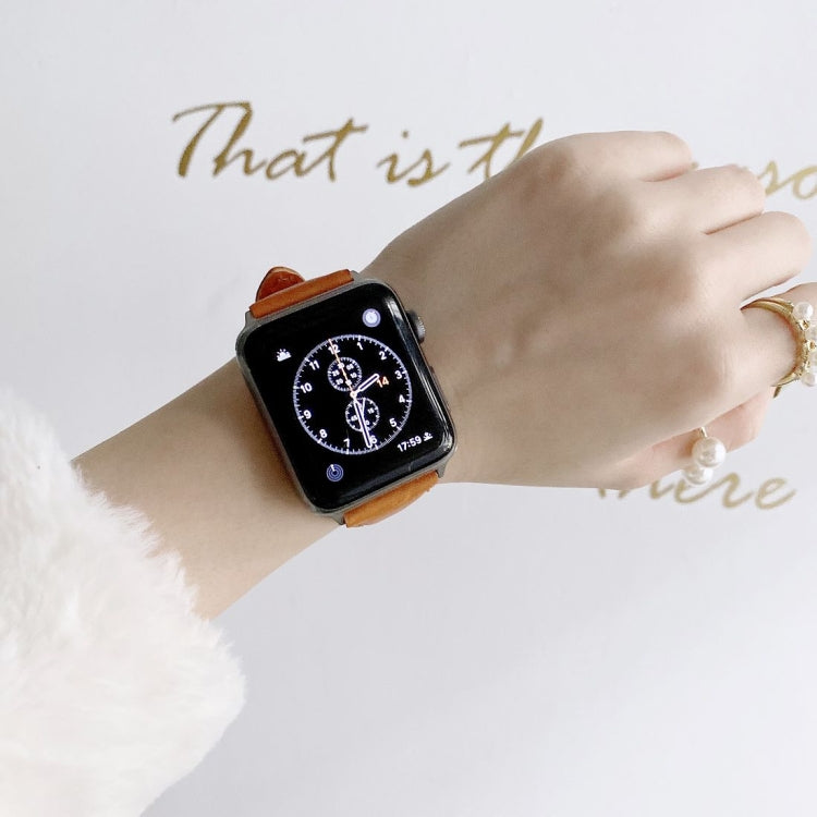 Tan leather watch band with metal buckle, double-sided replacement strap for Apple Watch.