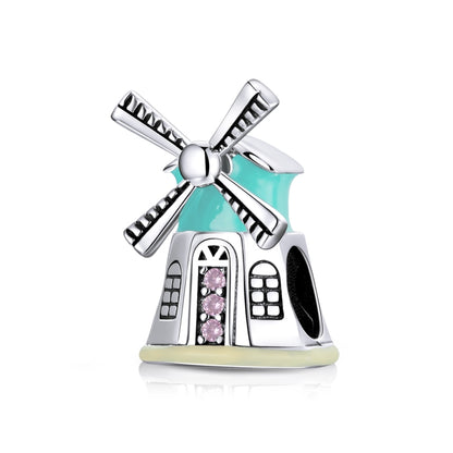 Sterling silver windmill charm bead with teal enamel and pink CZ centerpiece