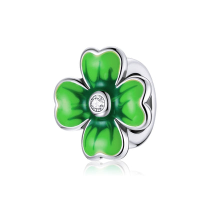 Green enamel lucky clover charm bead with small clear CZ center on silver frame