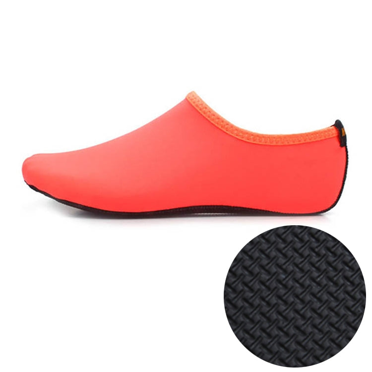Orange neoprene diving shoe with textured non-slip rubber sole