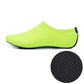 Neon green slip-on diving shoe with textured rubber sole tread inset