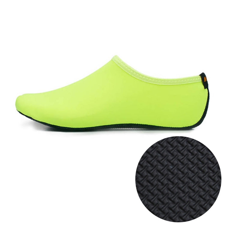 Neon green slip-on diving shoe with textured rubber sole tread inset