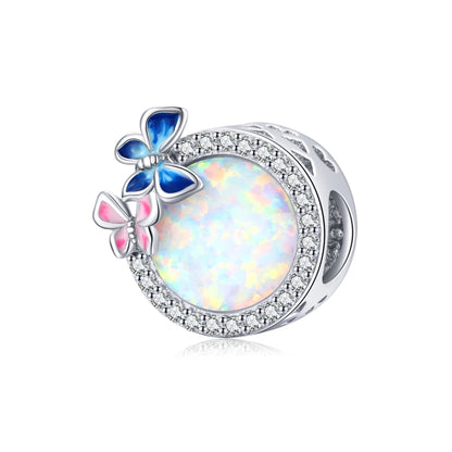 Sterling silver butterfly spring charm bead with blue and pink enamel and opal-like center