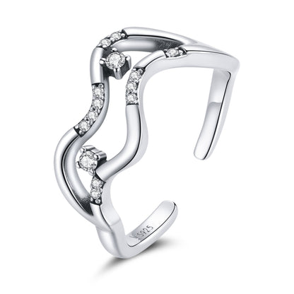 Oxidized sterling silver open ring with curved wave design and small CZ star accents