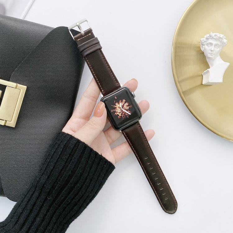 Leather watch band with metal buckle, dark brown strap and stitched edges