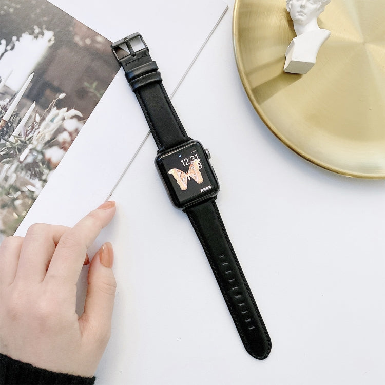 Black leather watch band with metal buckle and stitched strap holes