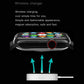 Waterproof smart watch with black face and colorful icons, wireless charging base