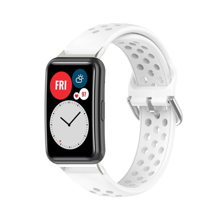 White perforated silicone watch strap with smartwatch display attached.
