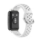 White perforated silicone watch strap holding a black smartwatch face.