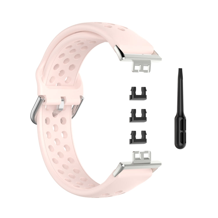 Light pink perforated silicone watch strap with clasp, replacement adapters, and pin tool.