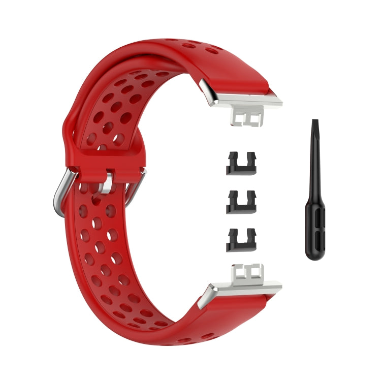 Red perforated silicone watch strap with clasp, replacement adapters, and pin tool.