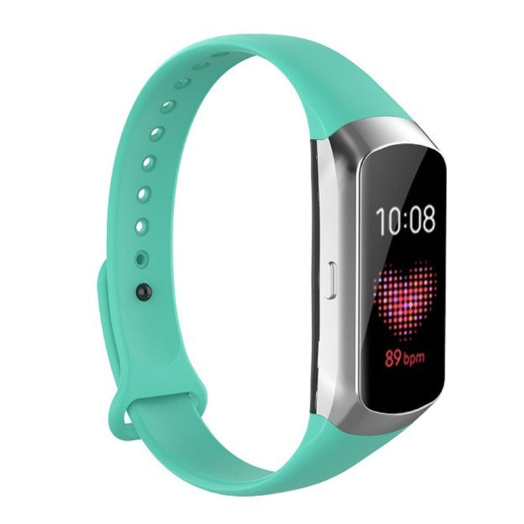 Mint green silicone watch strap with glossy nail-button clasp and perforation holes