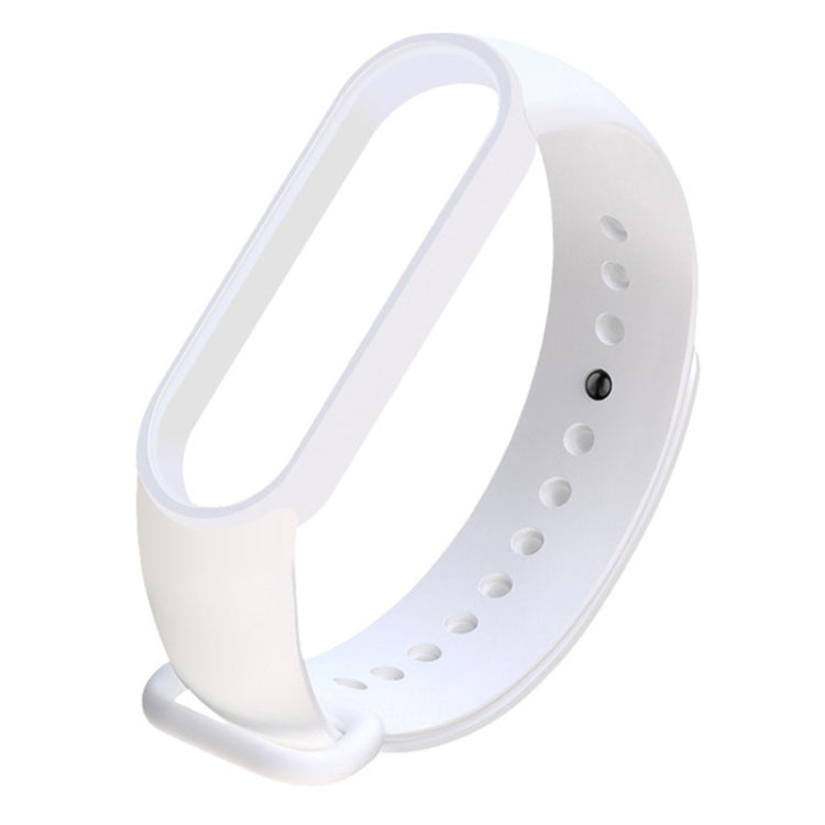 White silicone replacement watch strap with adjustable holes and clasp.