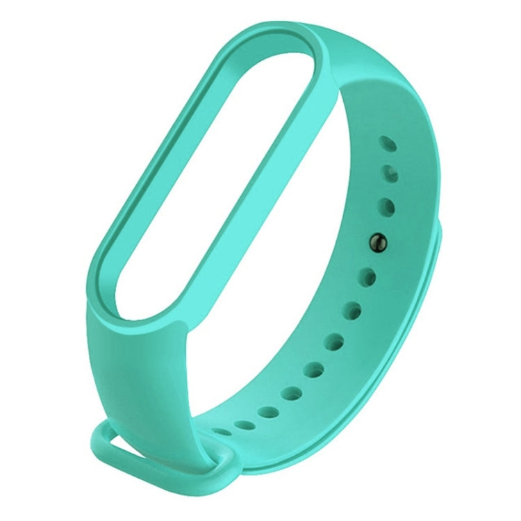 Mint green silicone replacement watch strap with adjustable holes and clasp.