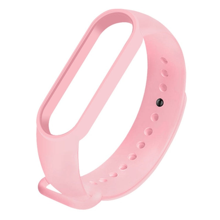 Light pink silicone replacement watch strap with adjustable holes and clasp.