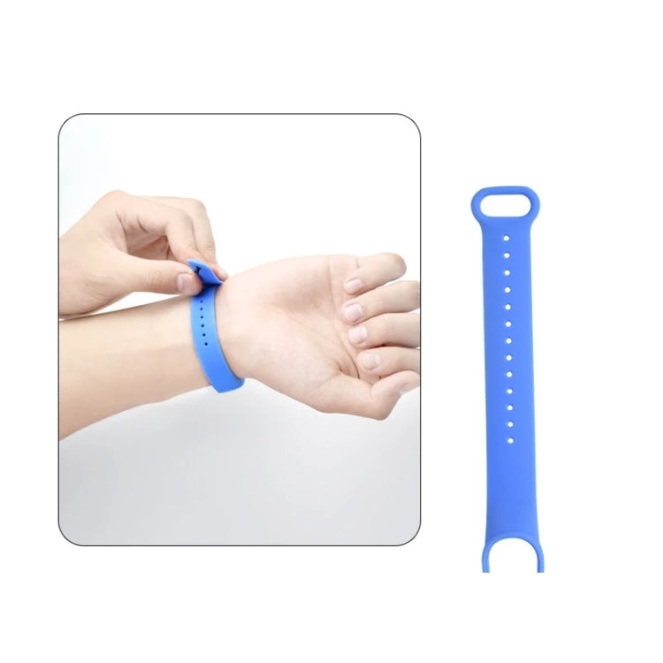 Silicone replacement watch strap for Mi Band 6, light blue silicone, shown on wrist