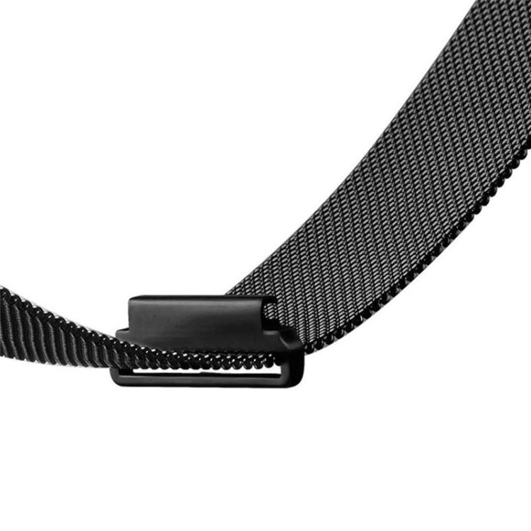 Close-up of black milanese watch band with rectangular clasp and connectors