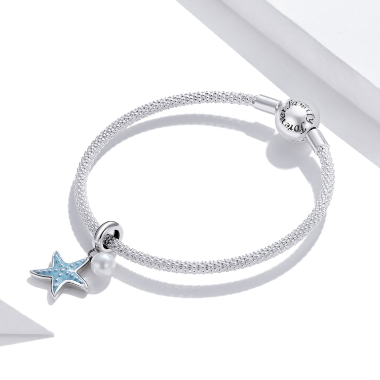 Silver mesh bracelet with blue starfish charm and white shell pearl