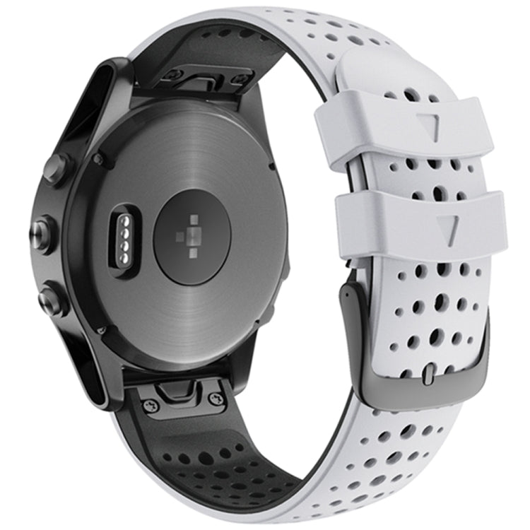 White perforated silicone watch strap with quick-release ends, shown on a black smartwatch