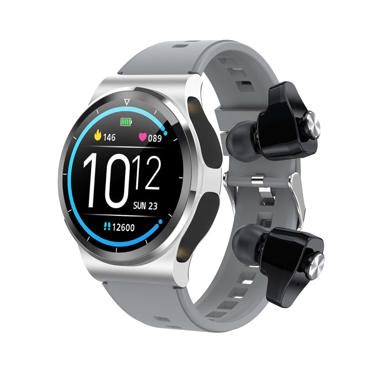Silver touchscreen smart watch with large digital time on display and silicone strap.