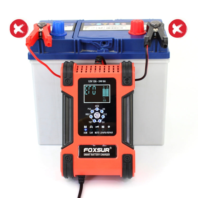 Battery charger connected to a blue lead-acid battery with visible red and black cables.