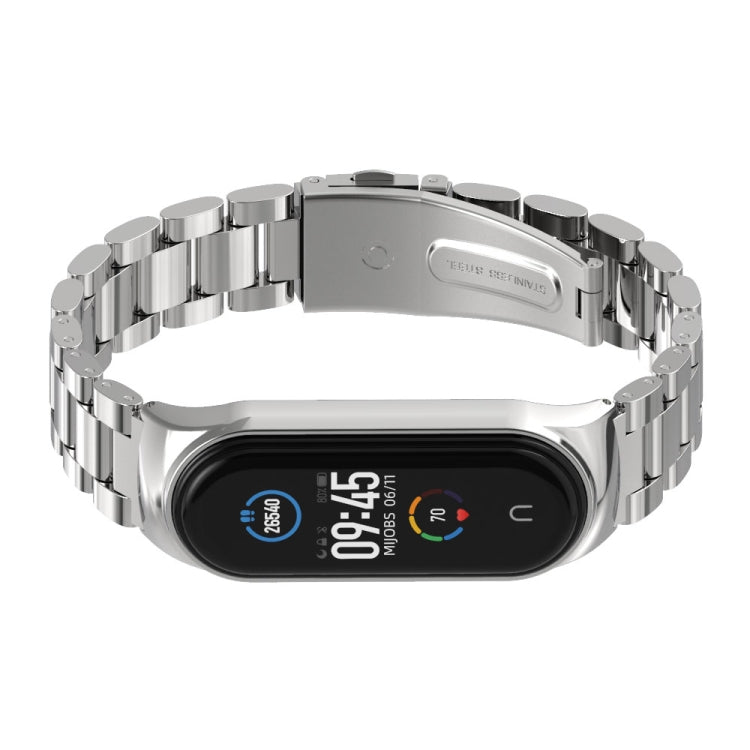 Stainless steel watch band with silver three-bead links and fitness tracker display