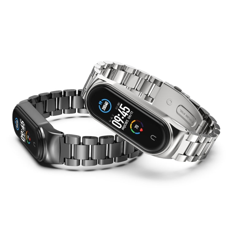 Stainless steel watch band with silver three-bead links with fitness tracker face visible