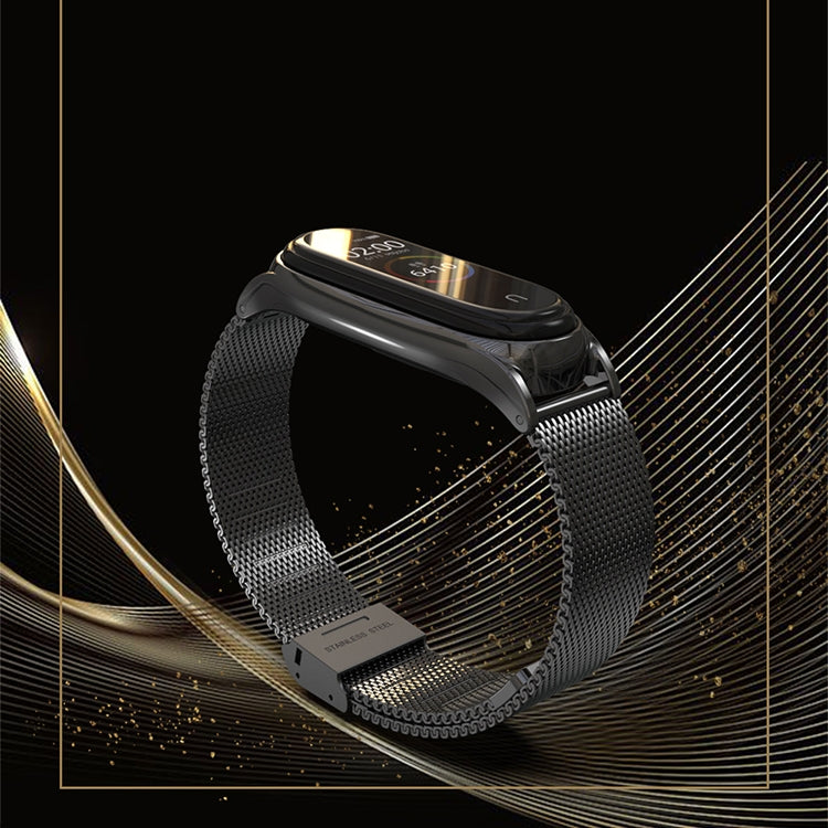 Black Milanese-style watch band with metal clasp and black smartwatch