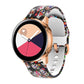 Black silicone watch band with colorful illustrated pattern and rose-gold buckle