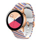 Silicone watch strap with rainbow wavy stripe pattern, rose gold connectors.