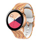 Silicone watch strap with thin multicolor stripe pattern, rose gold connectors.