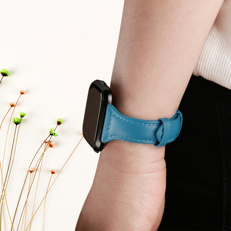Blue genuine leather smartwatch wrist strap with metal buckle on wrist