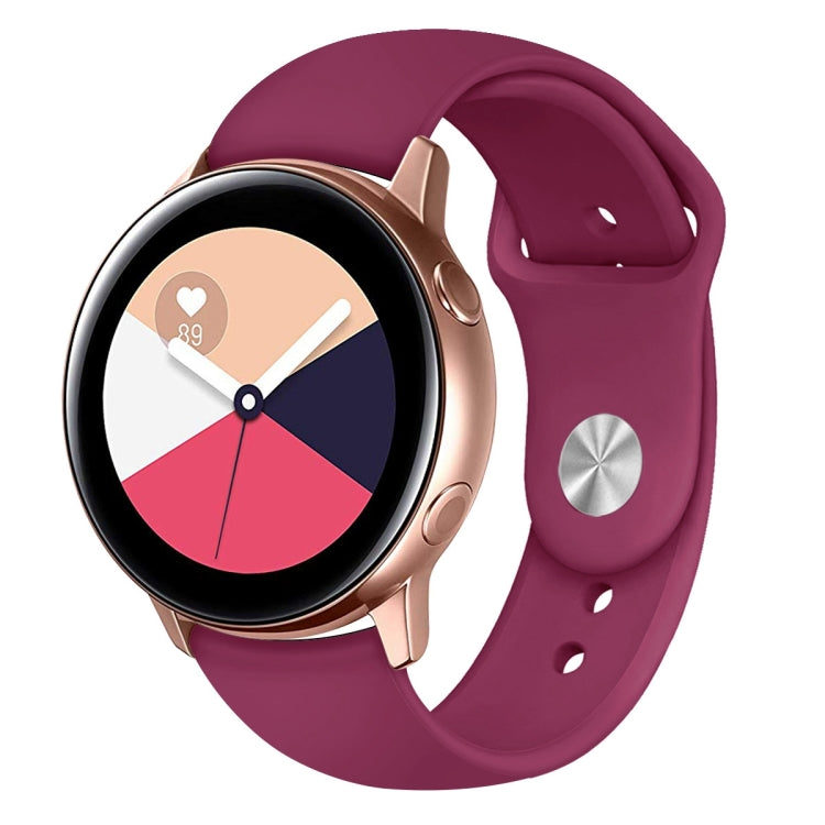 Wine red silicone smartwatch wrist strap with metal buckle and round watch face