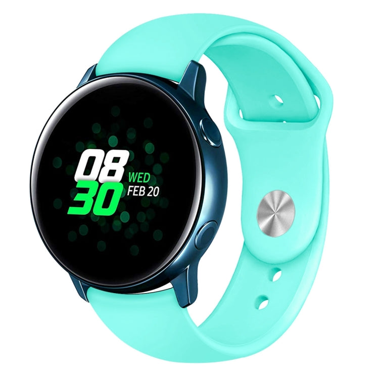 Mint green silicone smartwatch wrist strap with metal buckle and round watch face