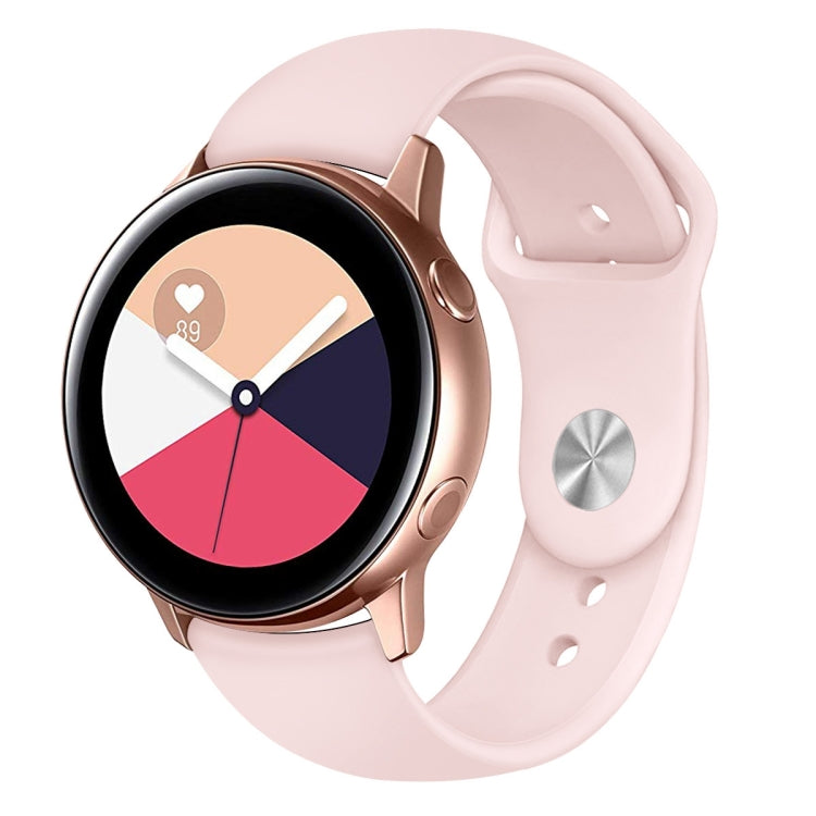 Pink silicone smartwatch wrist strap with metal buckle and round watch face