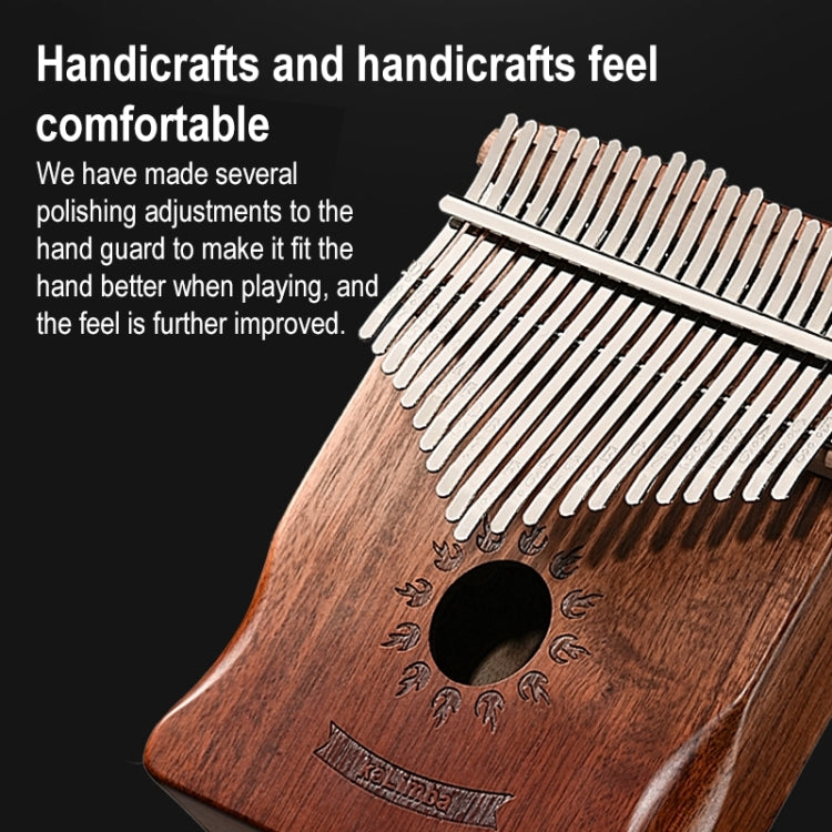 Wooden 17-tone kalimba close-up showing metal tines over sound hole