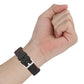 Black silicone watch strap on wrist with metal clasp and red stitched trim