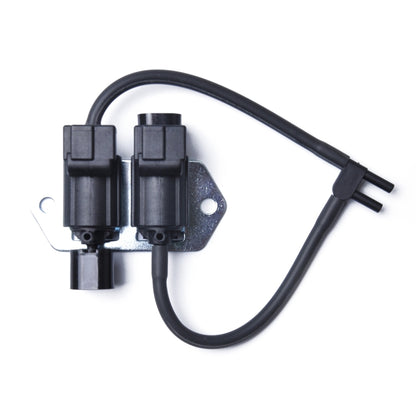 EGR valve control solenoid with twin black connectors and attached hoses