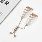 Rose gold heart-link watchband bracelet with chain and three dangling beads.