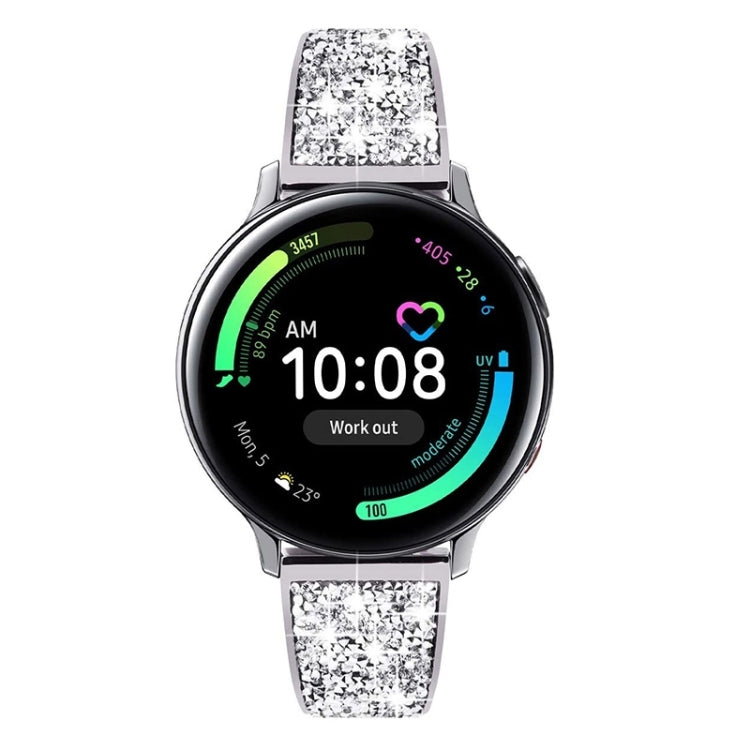 Silver metal watch band with sparkling crystal-pattern links on round smartwatch