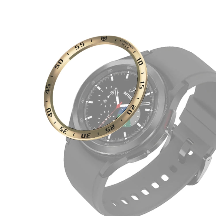 Gold-tone smartwatch bezel ring with engraved minute numbers around the watch display