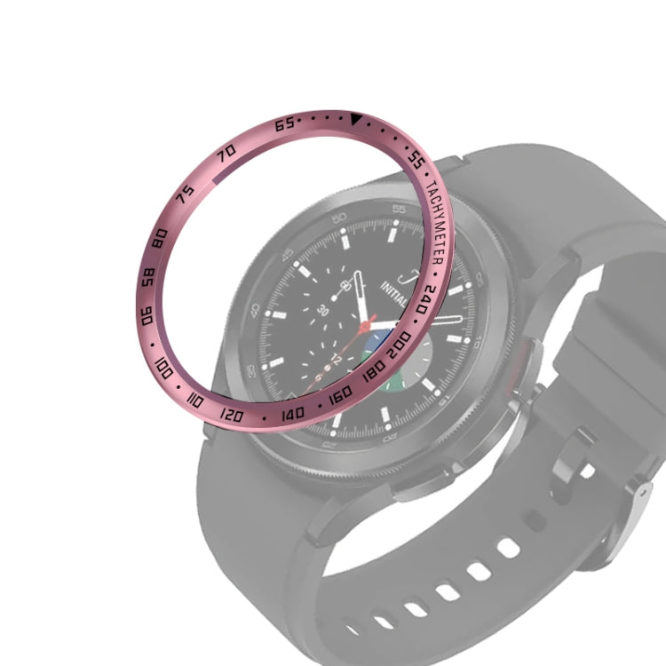 Smart watch with rose pink bezel ring and black dial, gray silicone strap