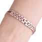 Rose gold X-shaped metal link watch band with diamond accents