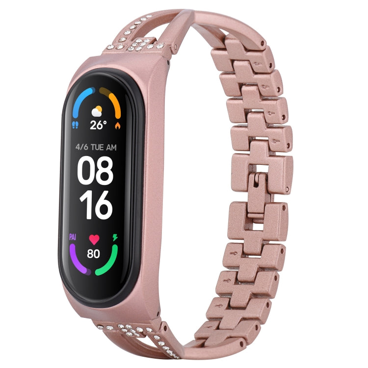 Rose gold X-shaped alloy watch band with rhinestone borders and metal clasp
