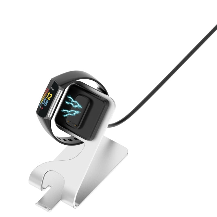 White metal magnetic charger holder with USB cable and black charging dock