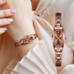 Rose gold tone women's quartz bracelet watch on wrist with diamond bezel and markers